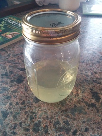 The same mixture, now contained in a sealed mason jar and sitting on a kitchen counter