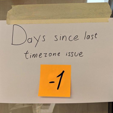 sign taped to glass, "Days since last timezone issue"

Sticky note: "-1"
